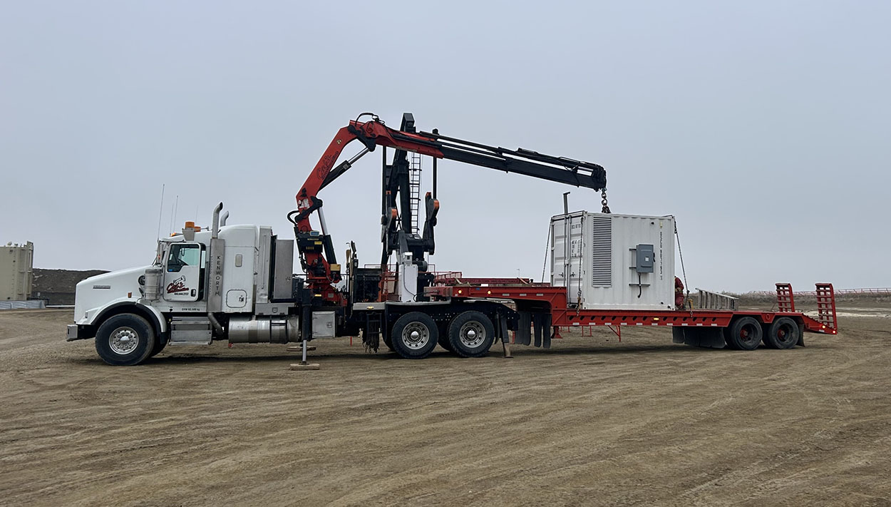 A large truck equipped with a crane on its top, ready for heavy lifting and construction tasks.
